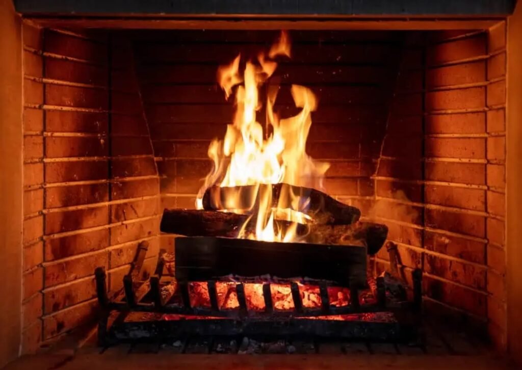 Warm indoor fireplace representing safe chimney operation and maintenance