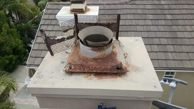 Close-up of a missing chimney cap allowing water intrusion