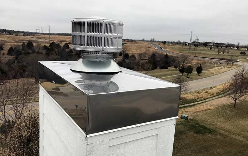 Stainless steel chimney chase cover with cross-break and welded seam